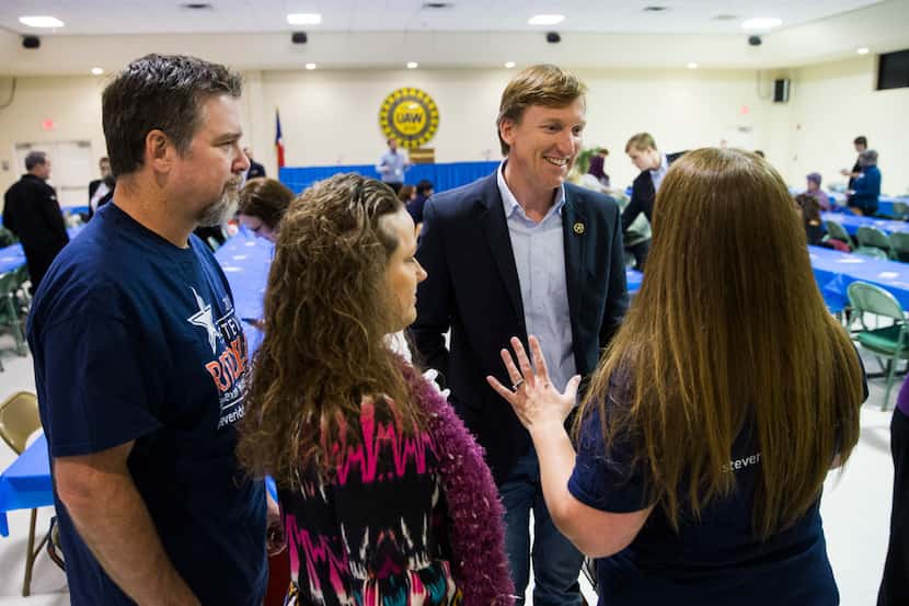 Gubernatorial candidate Andrew White (second from right) talks with supporters at The...