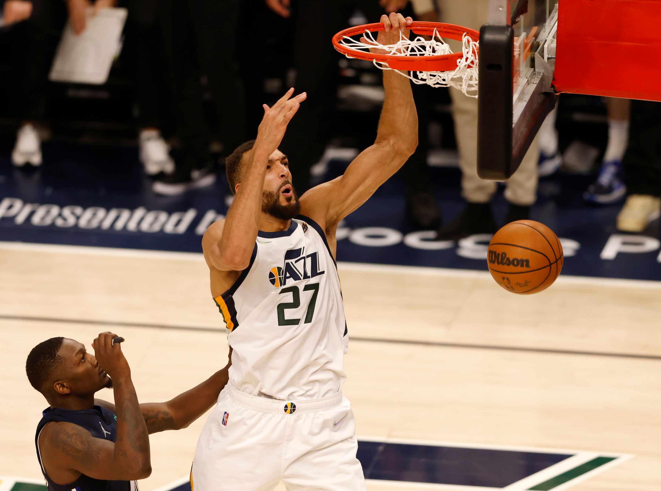 Utah Jazz center Rudy Gobert (27) dunks the ball in front of Dallas Mavericks forward Dorian...