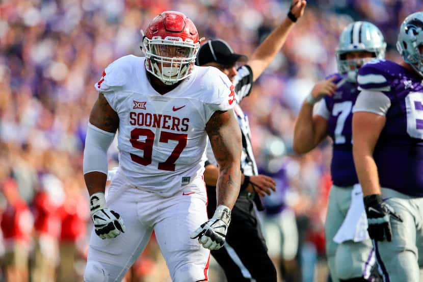 FILE - In this Oct. 17, 2015, file photo, Oklahoma defensive tackle Charles Walker (97)...