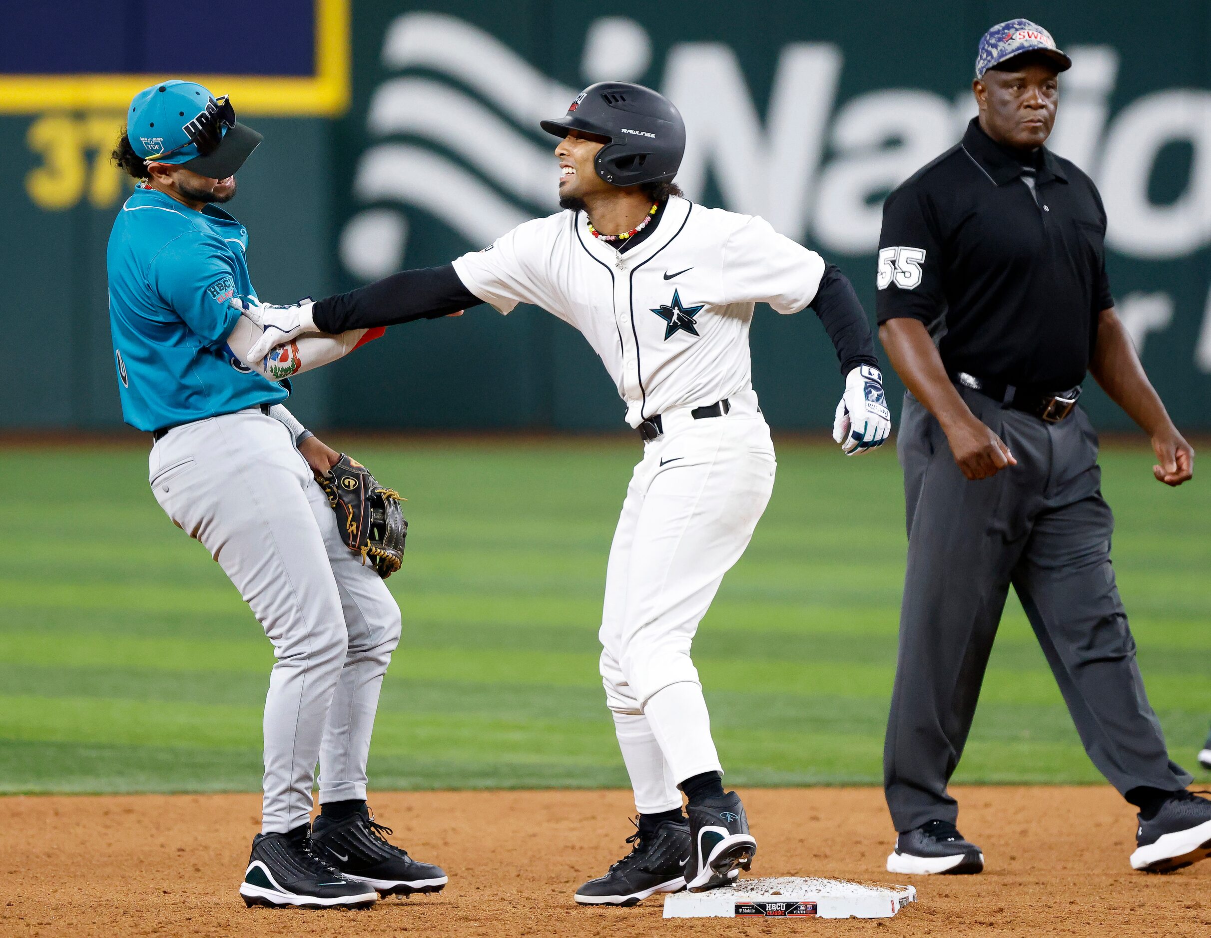 American League batter Tiger Borom (1) swings at his National League and Grambling State...