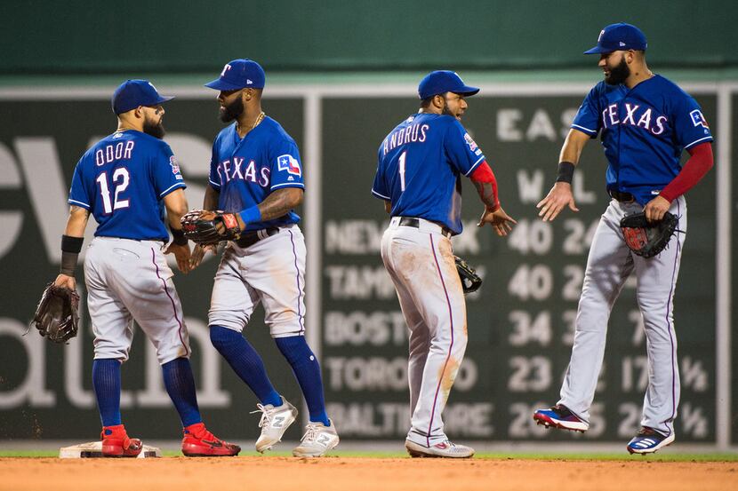 BOSTON, MA - JUNE 10: Elvis Andrus #1 and Rougned Odor #12 of the Texas Rangers celebrate...