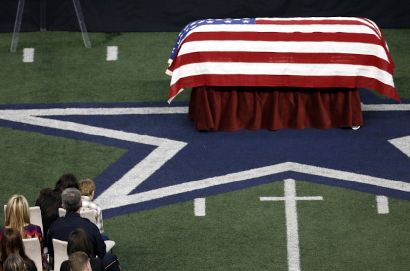 Taya Kyle, top left, wife of former Navy SEAL Chris Kyle talks to her son during the...