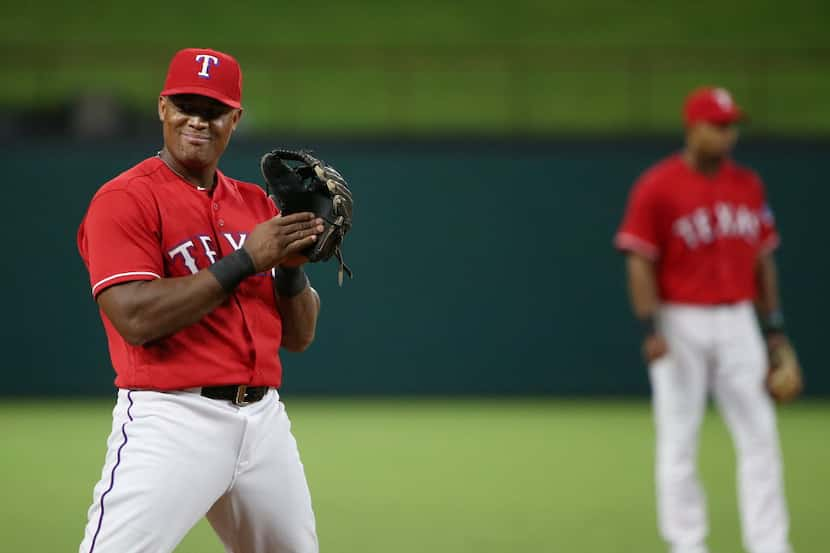 Texas Rangers third baseman Adrian Beltre (29) looks toward to the Oakland Athletics dugout...