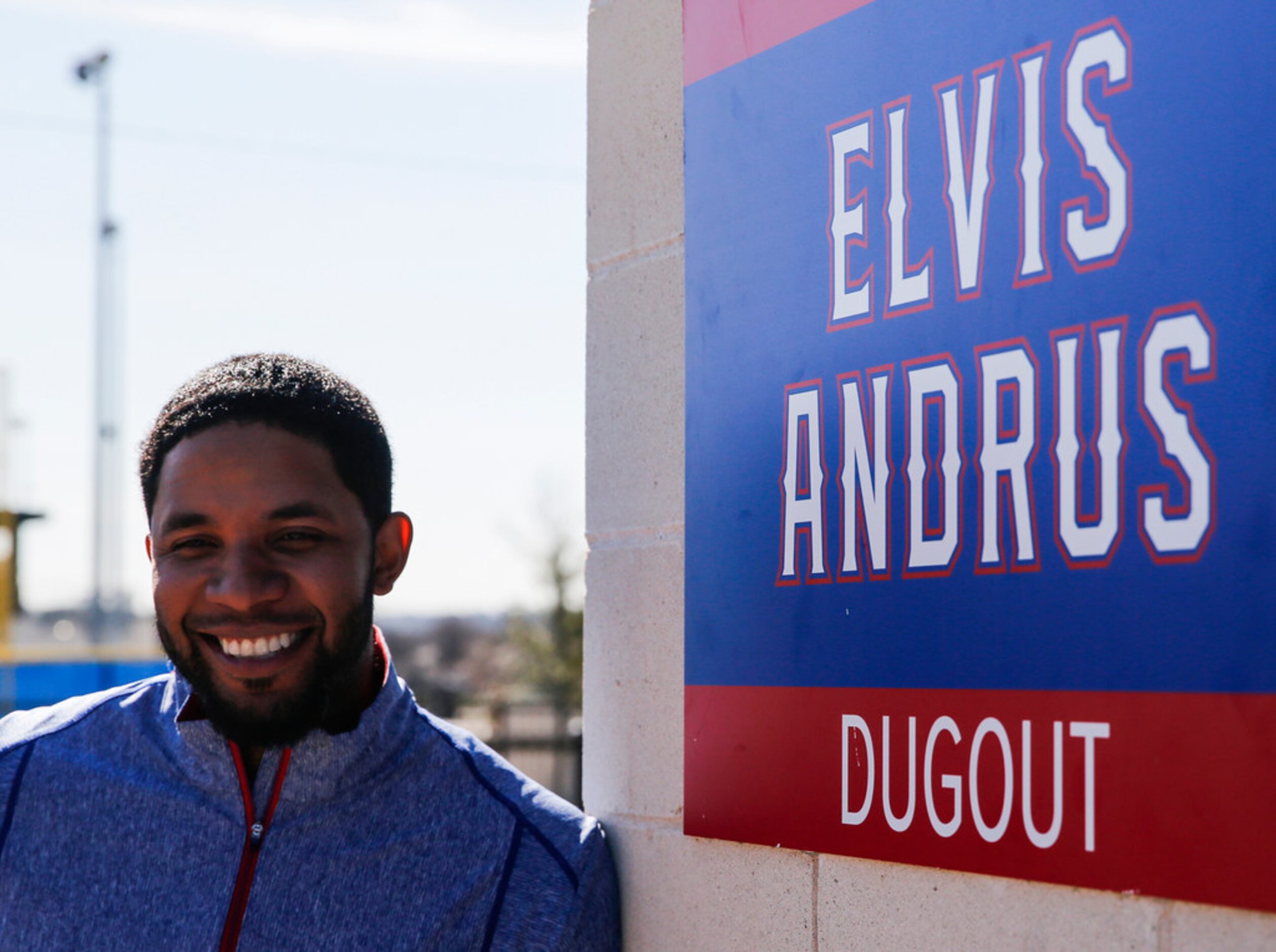 Rangers shortstop Elvis Andrus poses by a newly renamed dugout after donating baseball and...