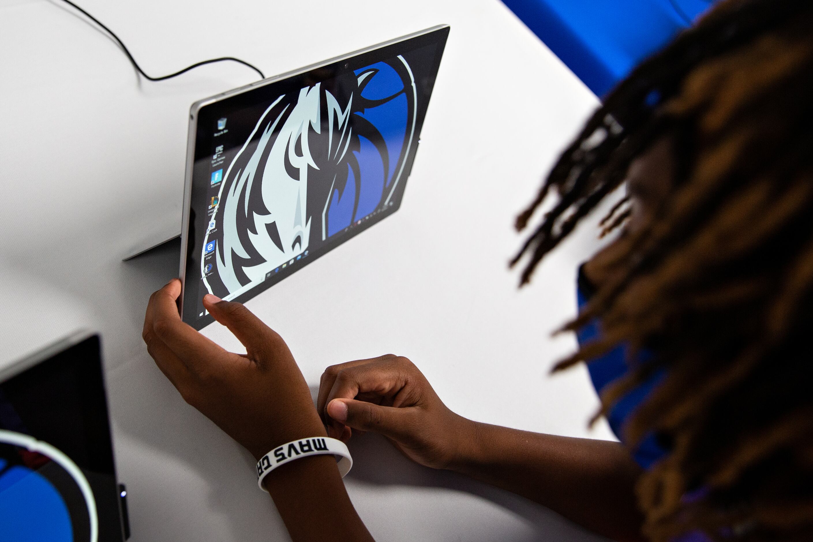 Sam Patterson, 11, sees what there is to explore on the iPads available to youth at the Mavs...