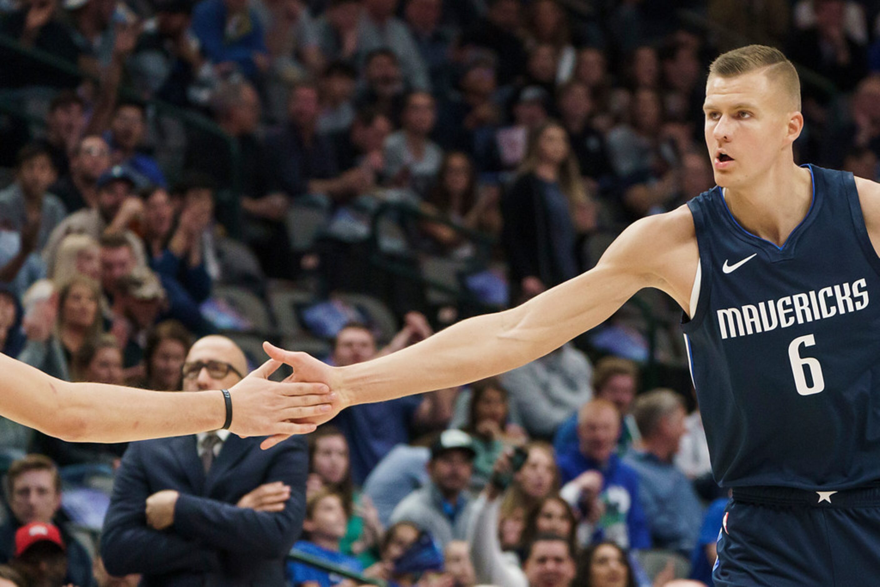 Dallas Mavericks forward Kristaps Porzingis (6) celebrates with guard Luka Doncic during the...