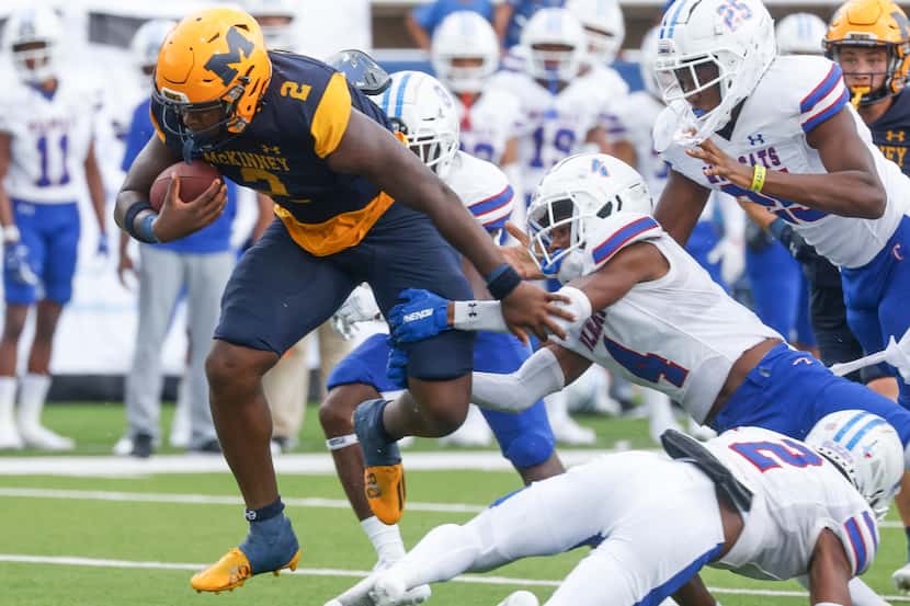 McKinney High’s Bryan Jackson (2) gets tackled by Temple High’s Neaten Mitchell (4) during a...