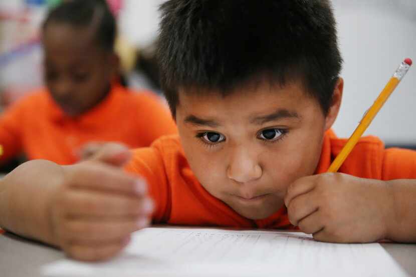 Gerardo Quijas, 6, works on a math exercise in the first grade class of teacher Brittany...