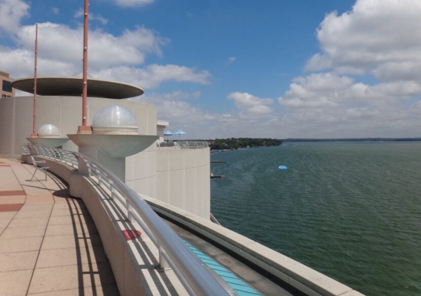 Monona Terrace's broad garden-laden deck overlook's Madison's Lake Monona. The striking...