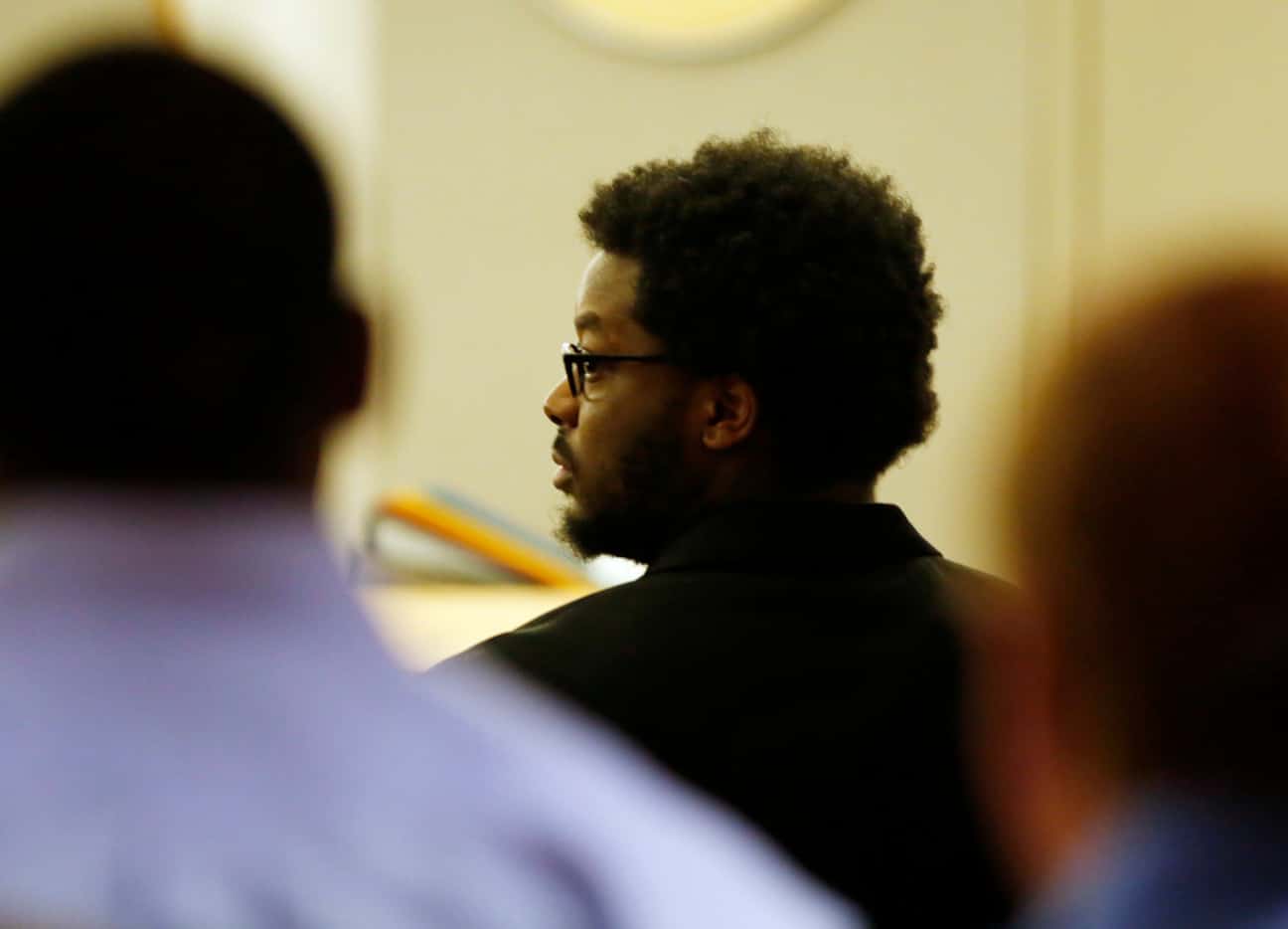 Thomas Johnson watches as jurors make their way out of the courtroom during the second day...
