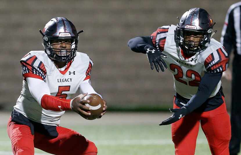 TXHSFB Mansfield Legacy junior quarterback Jalen Catalon (5) fakes a hand off too senior...