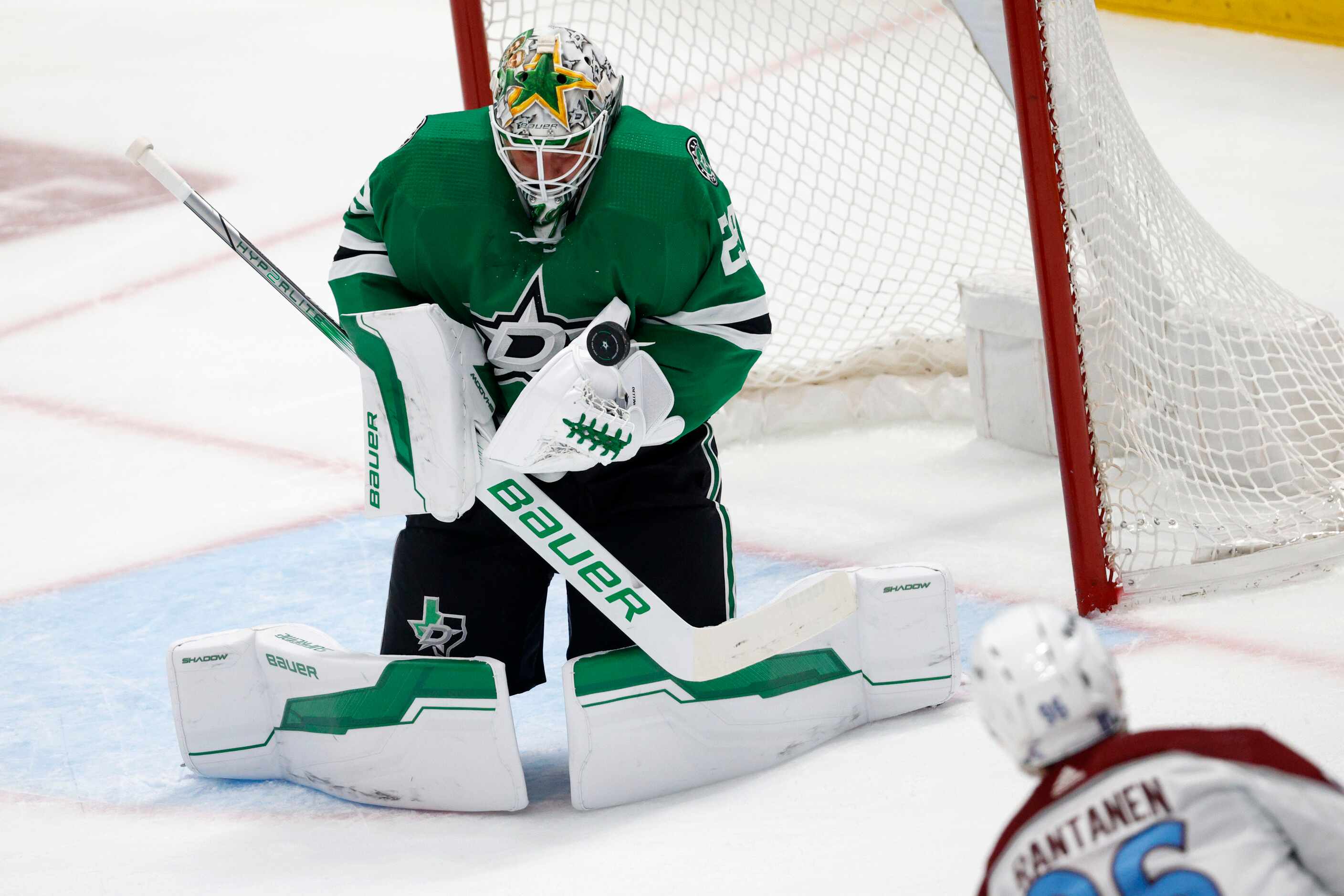 Dallas Stars goaltender Jake Oettinger (29) makes a save against Colorado Avalanche right...