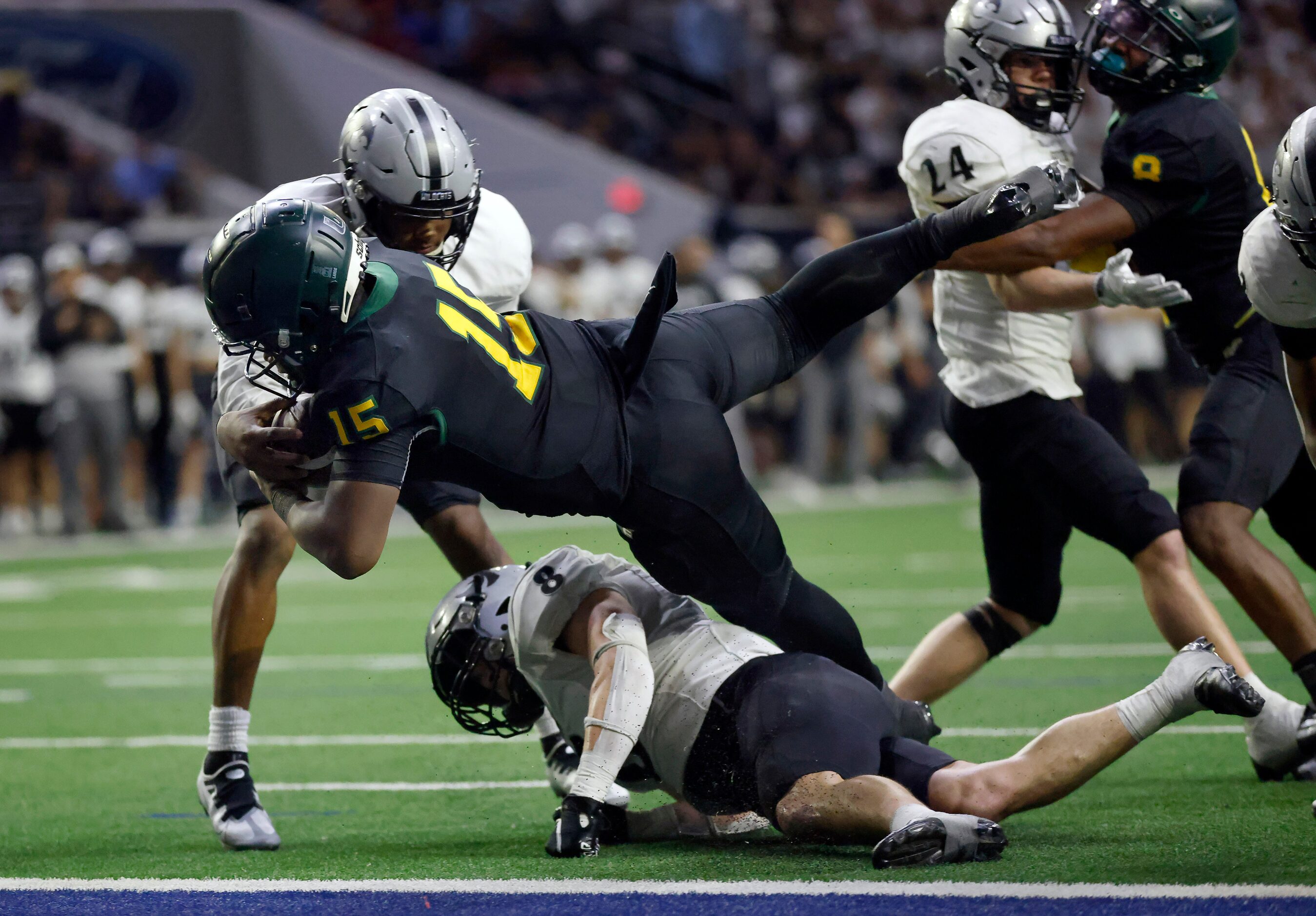 DeSoto quarterback Darius Bailey (15) dives for a fourth quarter touchdown against Denton...