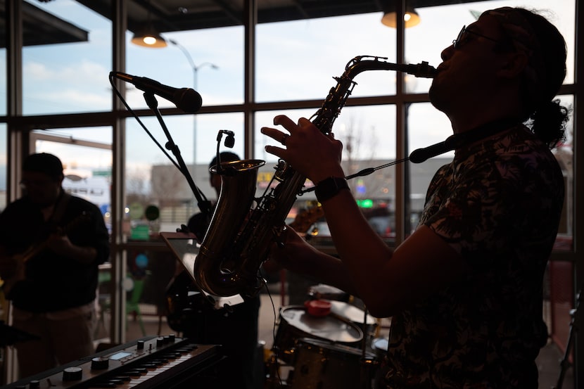 Christian Ortiz, 29, right, musical director for cumbia group Sabor Puro, performs inside La...