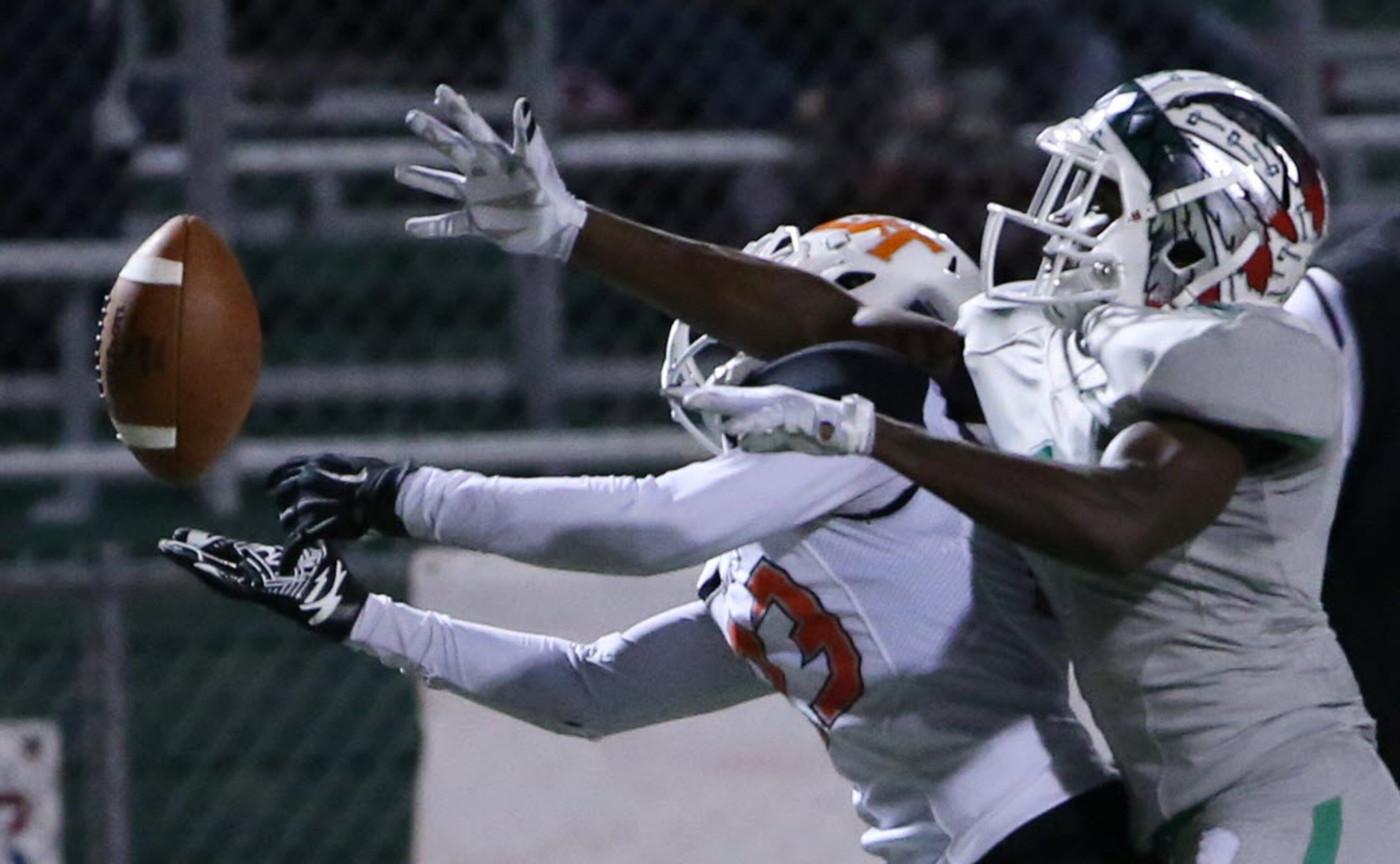 Lancaster defensive back Jaymir Sparrow (23) and Waxahachie wide receiver Jalen Reagor (1)...