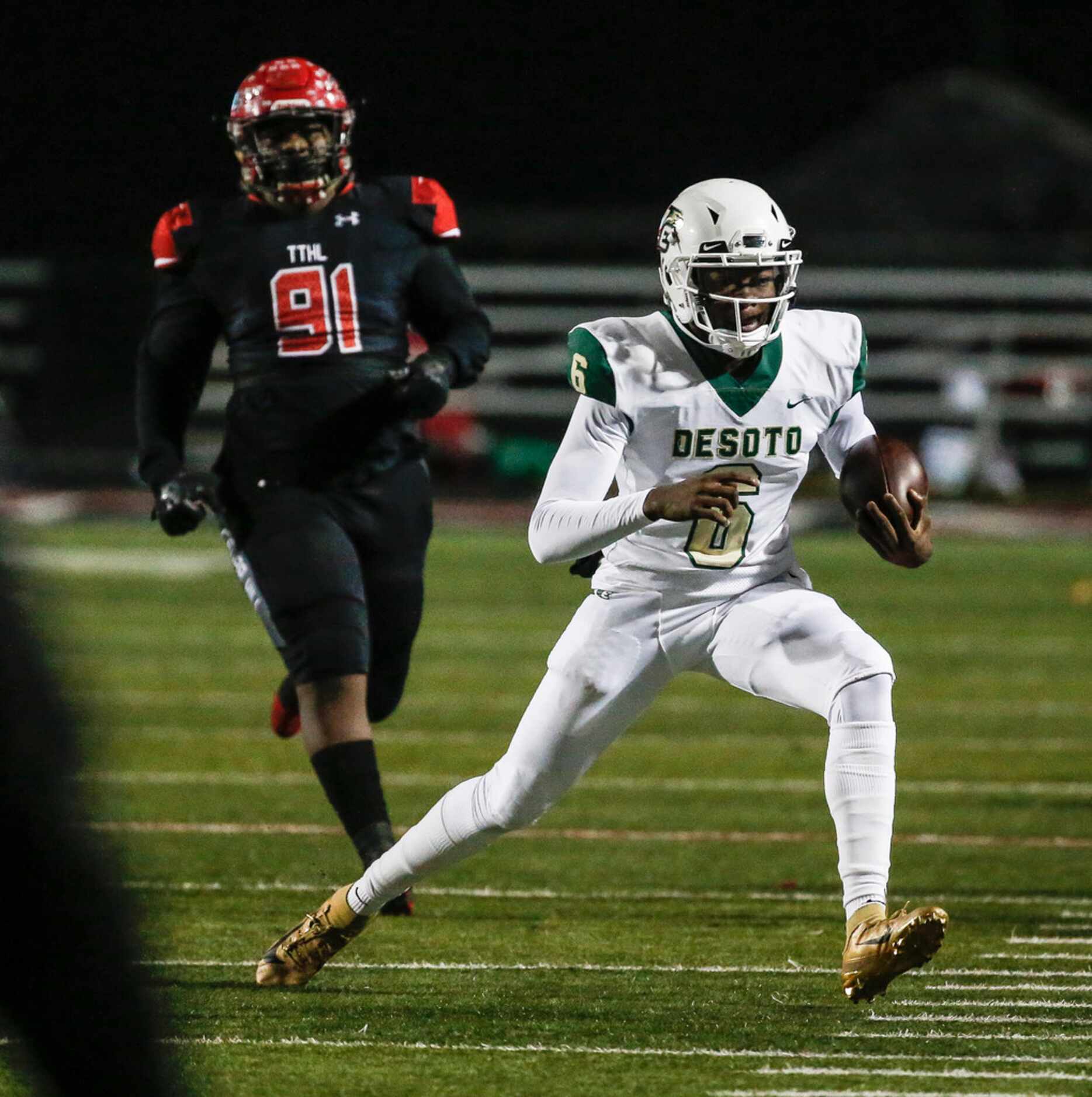 DeSoto quarterback Samari Collier (6) makes a break away from Cedar Hill defensive tackle...