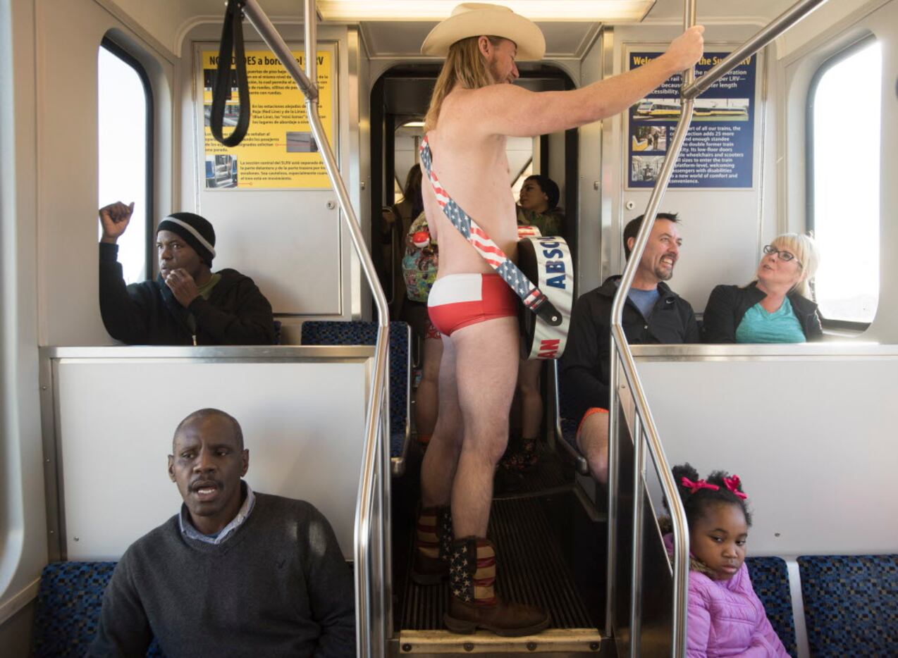 Paul Allen, Dallas Naked Cowboy, rides the train during the No Pants Subway Ride Dallas...