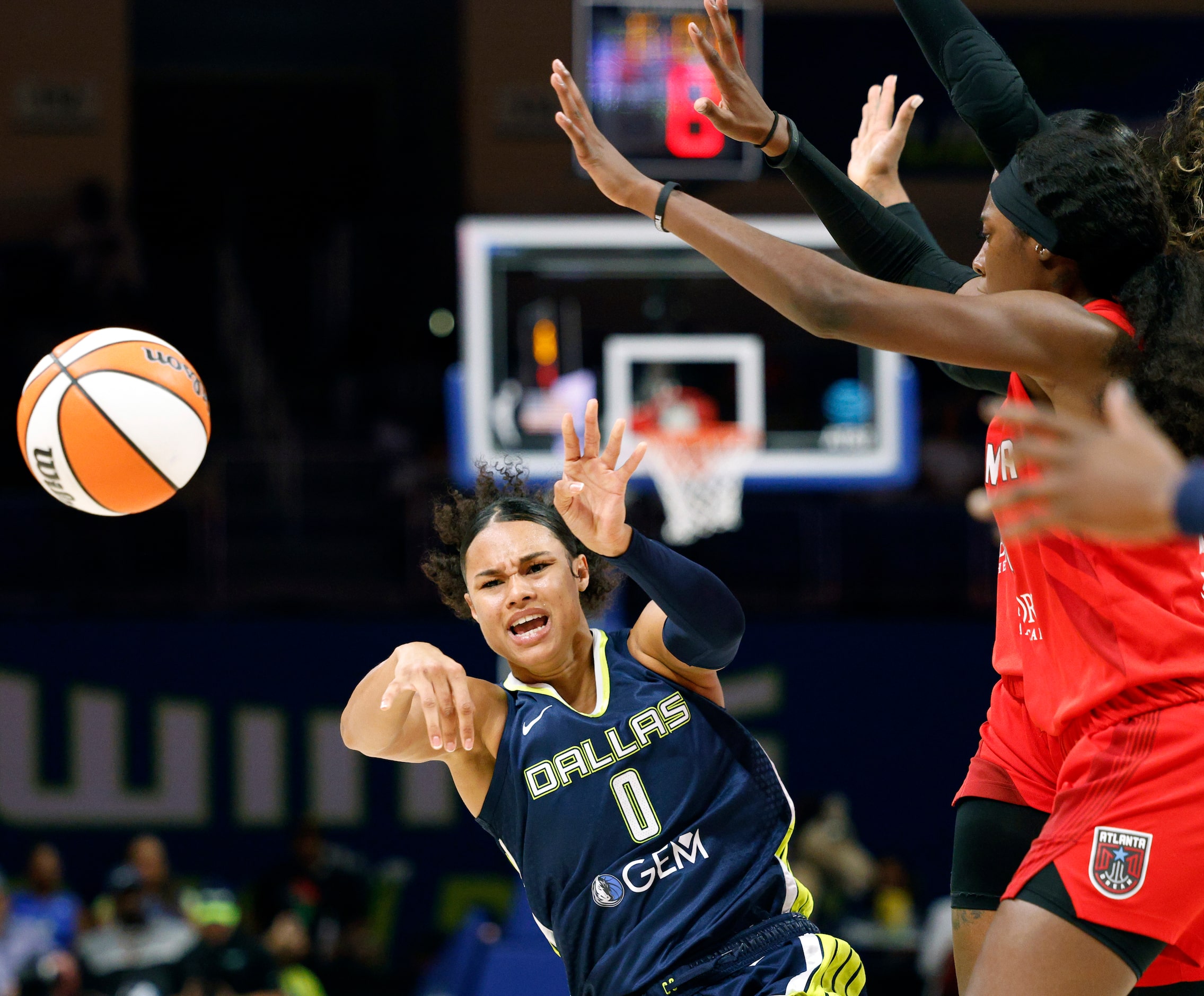 Dallas Wings forward Satou Sabally (0) passes the ball as she falls to the court during the...