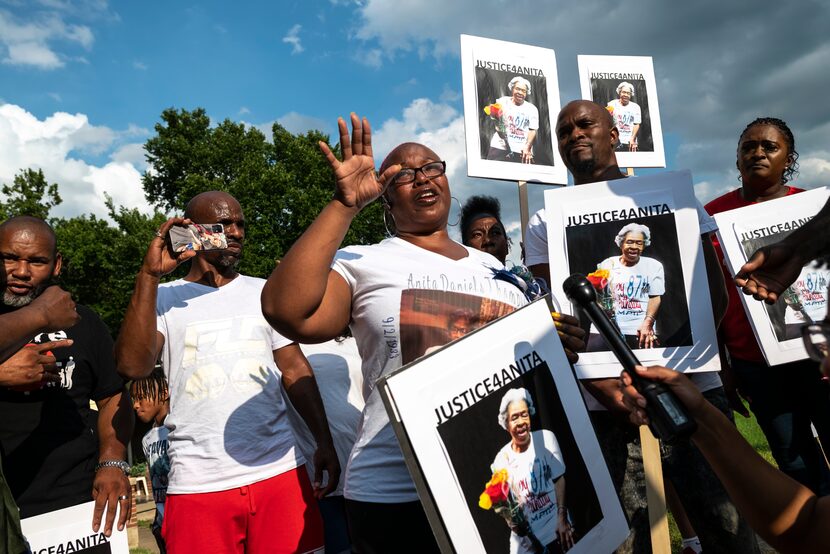 Danye'll Jefferson, center, grand daughter of Anita Thompson, emotionally breaks down while...