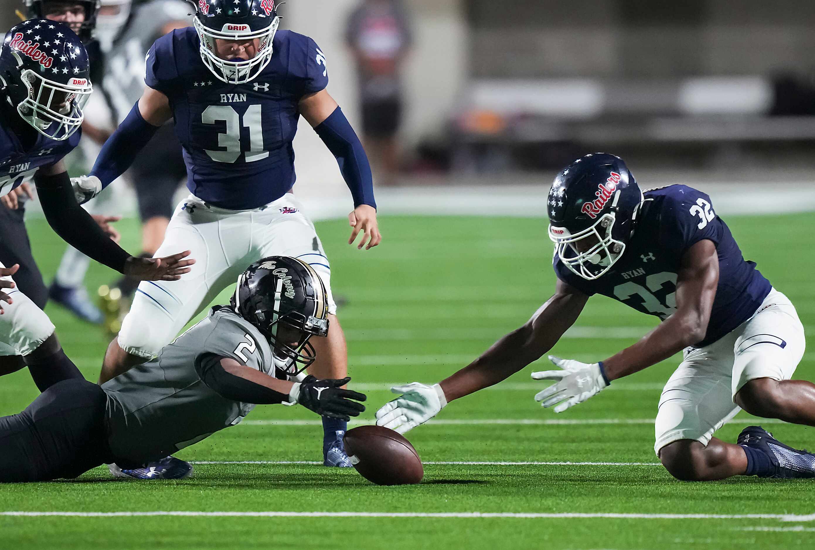 Denton Ryan defensive lineman Adrian Anderson (32) recovers a fumble by The Colony’s Dominic...