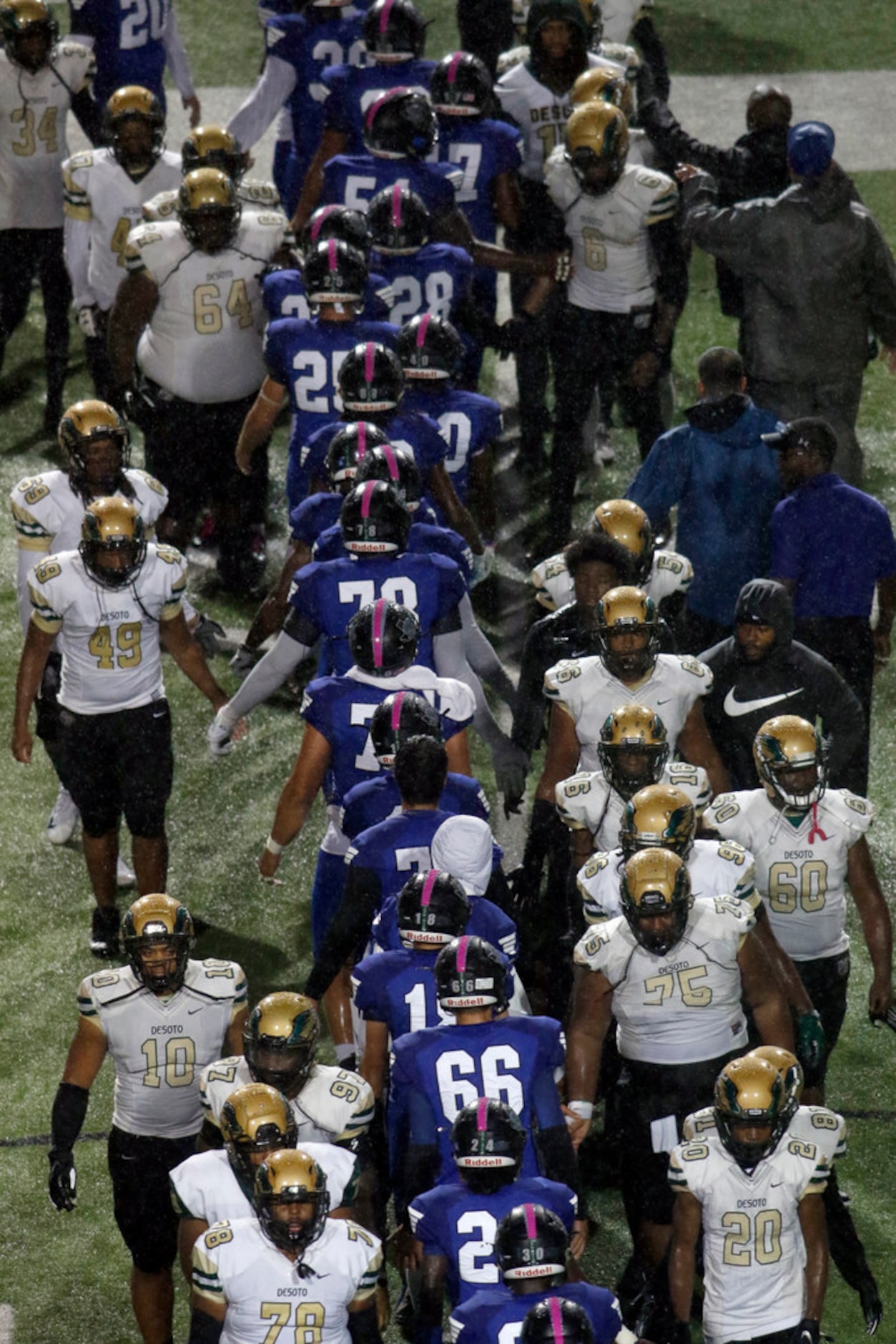 Players from DeSoto and Mansfield Summit meet at midfield following Summit's 27-26 victory...