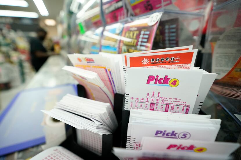 Lottery play stubs, including one for the Powerball, are seen on display at a liquor store...