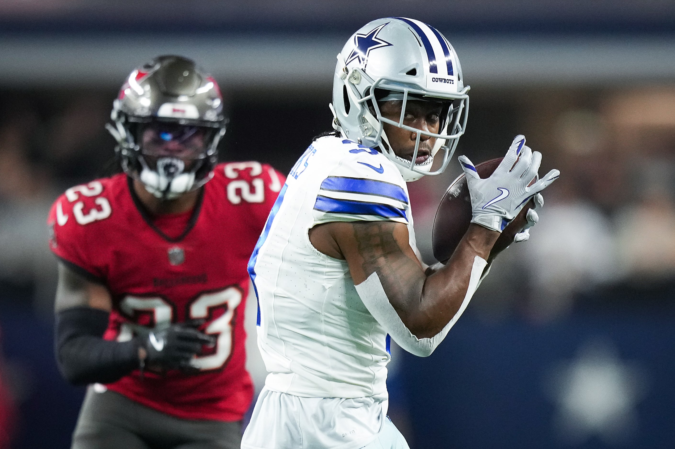 Dallas Cowboys wide receiver Brandin Cooks (3) catches a pass as Tampa Bay Buccaneers safety...