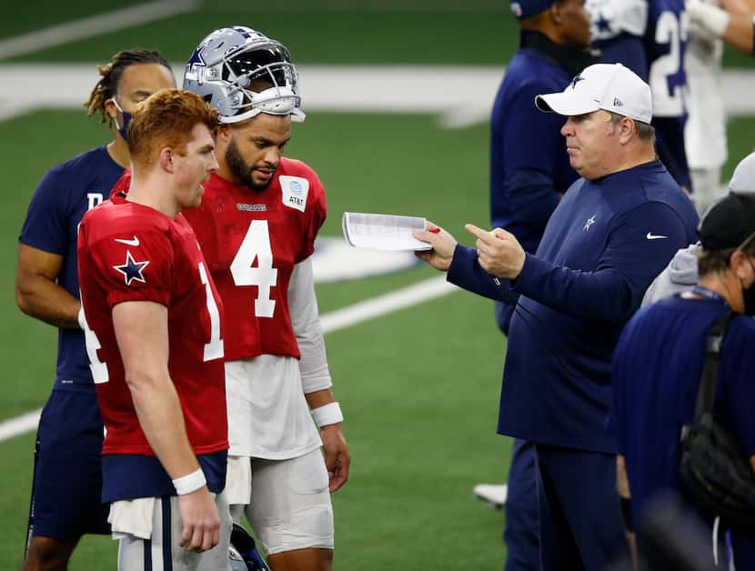 Dallas Cowboys head coach Mike McCarthy talks with Dallas Cowboys quarterback Andy Dalton...