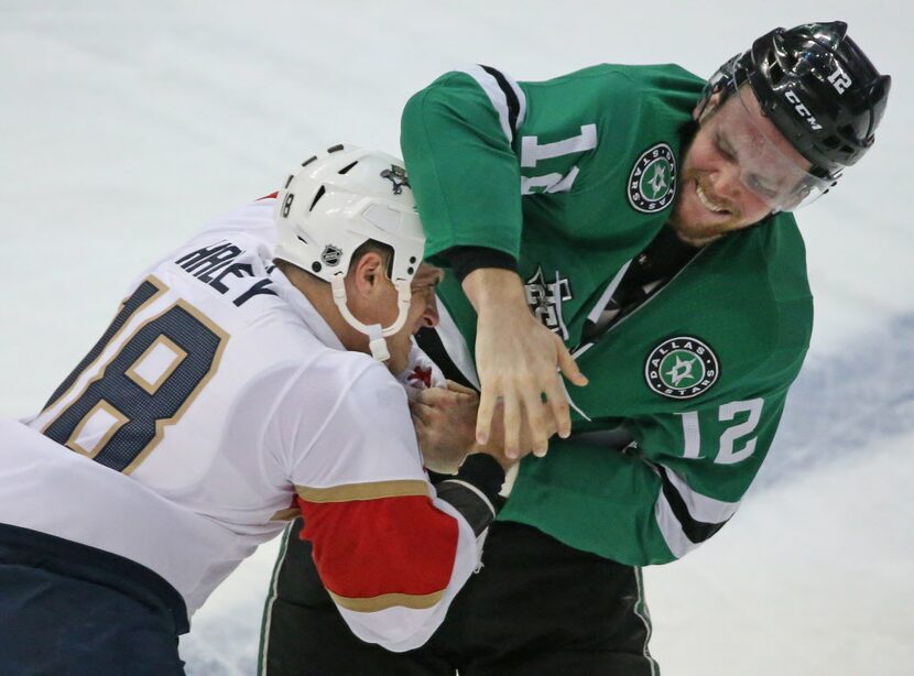 Dallas Stars center Radek Faksa (12) and Florida Panthers center Micheal Haley (18) fight...