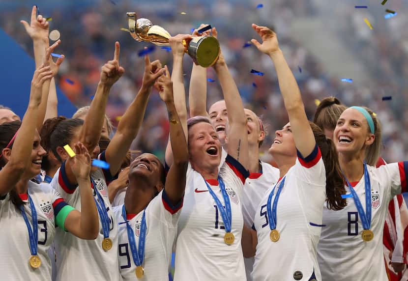 FILE - United States' Megan Rapinoe holds the trophy celebrating at the end of the Women's...
