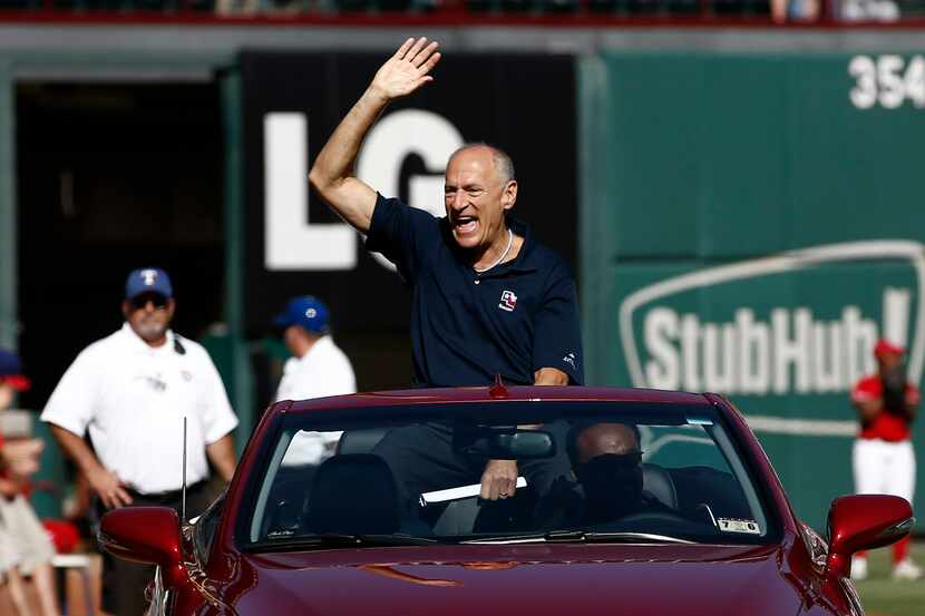 Texas Rangers radio announcer Eric Nadel waves to fans before being presented with the 2014...