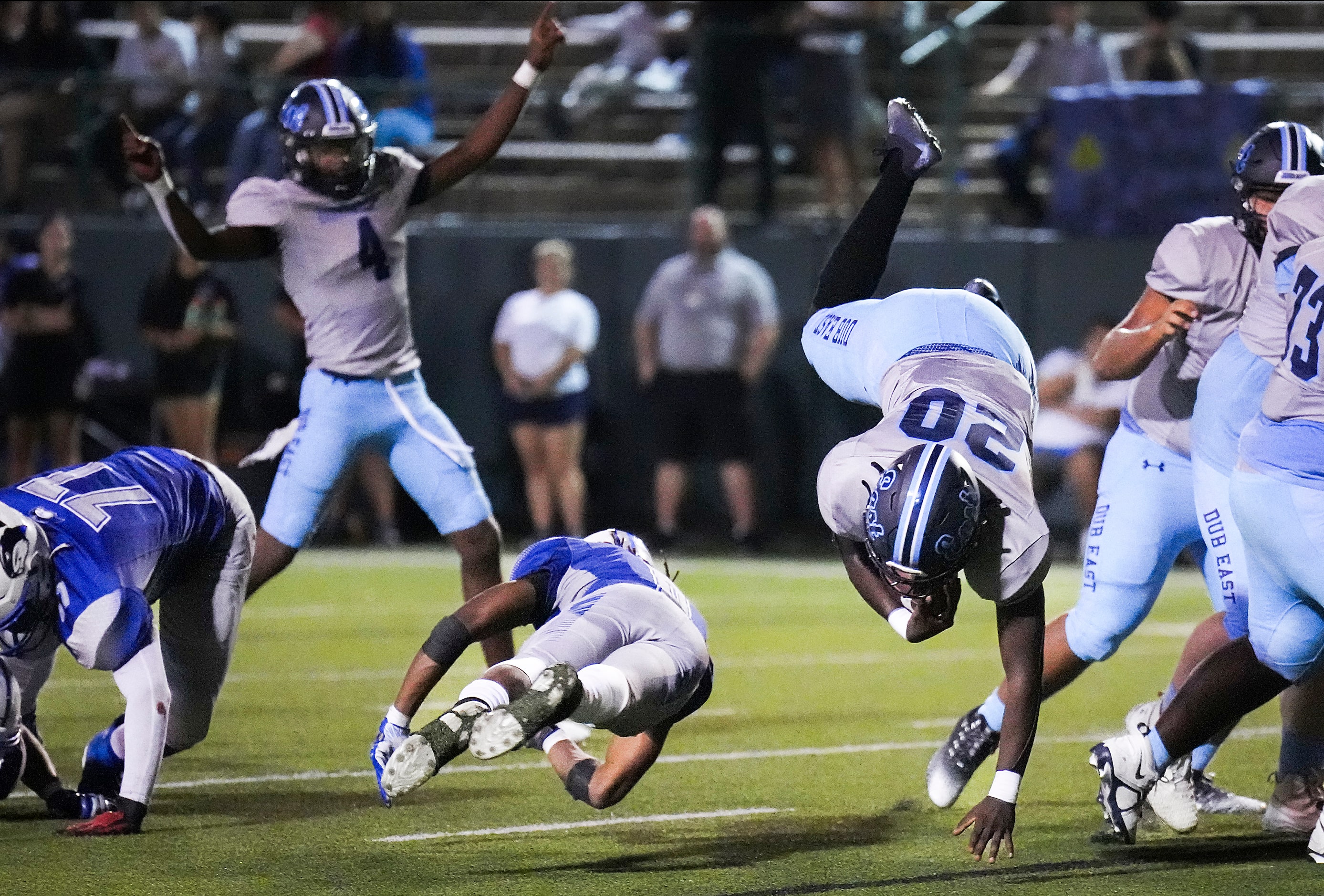 Wylie East running back Keshaun Scott (20) flips into the end zone past Grand Prairie...