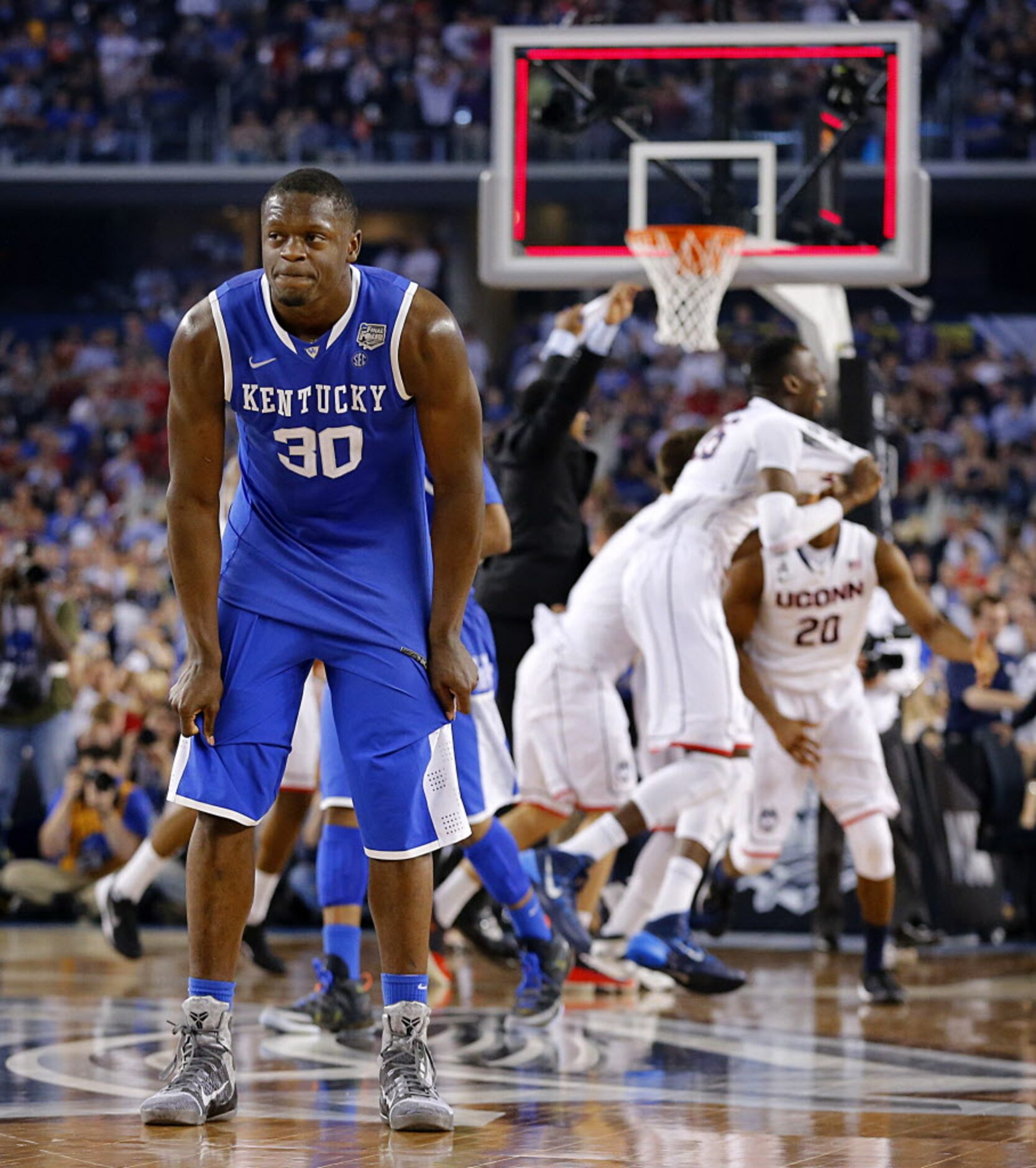 Kentucky Wildcats forward Julius Randle (30) of Dallas stands dejected on the court as the...