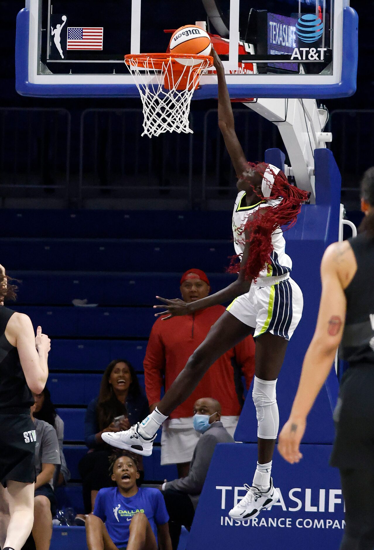 Dallas Wings center Awak Kuier (28) dunks the ball on the Seattle Storm defense during the...