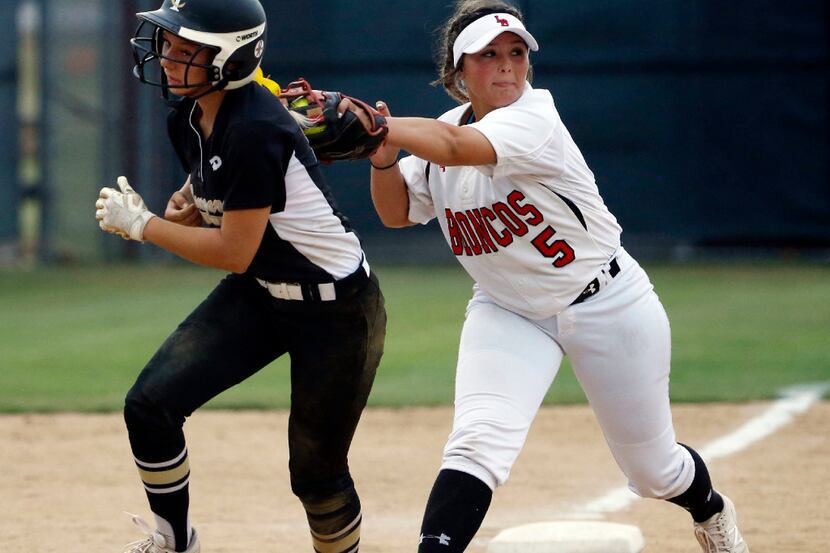 The Colony's Morgan Olson (10) is tagged in a run down by  Mansfield Legacy's Brittany Munoz...