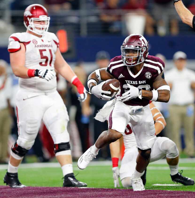 Texas A&M Aggies defensive back Armani Watts (23) celebrates his fumble recovery on the goal...