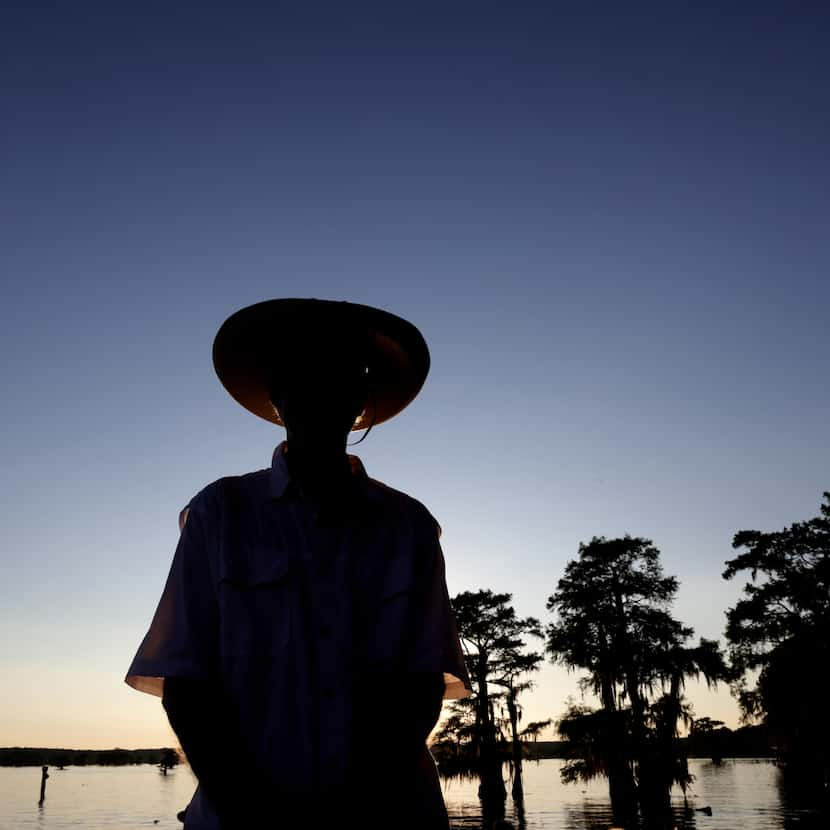 Shannon Wynne looks on as happy guests depart his Caddo Lake unveiling.