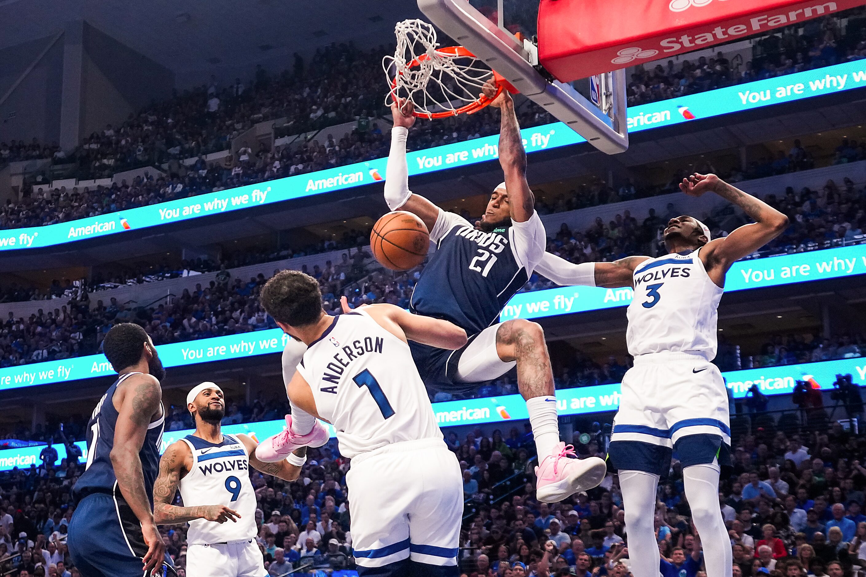 Dallas Mavericks center Daniel Gafford (21) dunks the ball past Minnesota Timberwolves...