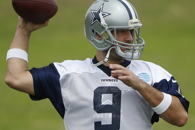 Dallas Cowboys quarterback Tony Romo (9) throws the ball during organized team activities at...