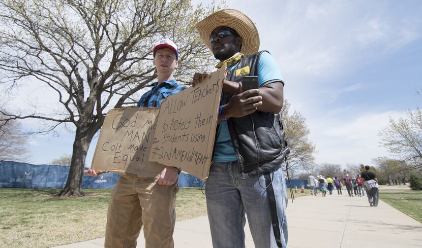 Pro-gun advocates Trevor Jackson and a man who gave his name as "The Black Rebel" were at...