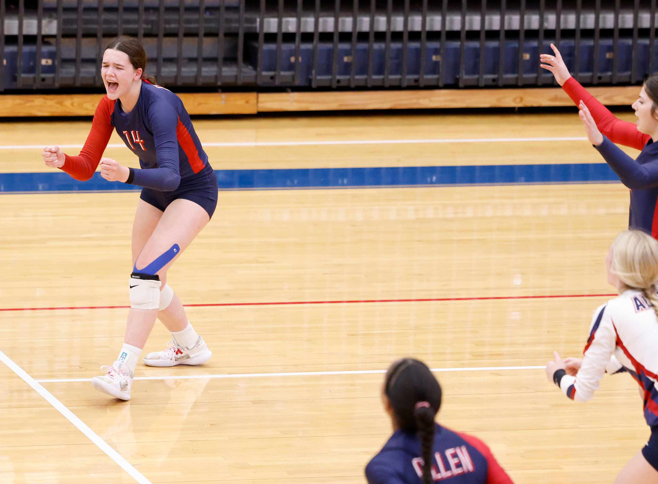 Allen junior Alyssandra Boyte (14) celebrates a point against Denton Guyer in the third set...