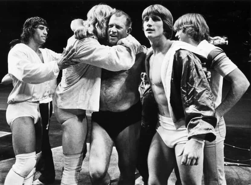 Fritz (center), patriarch of the Von Erich family of wrestling, including sons (from left)...
