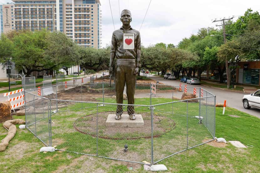 The Man With a Glass Heart statue, as well as trees in the medians along Hi Line Drive, have...