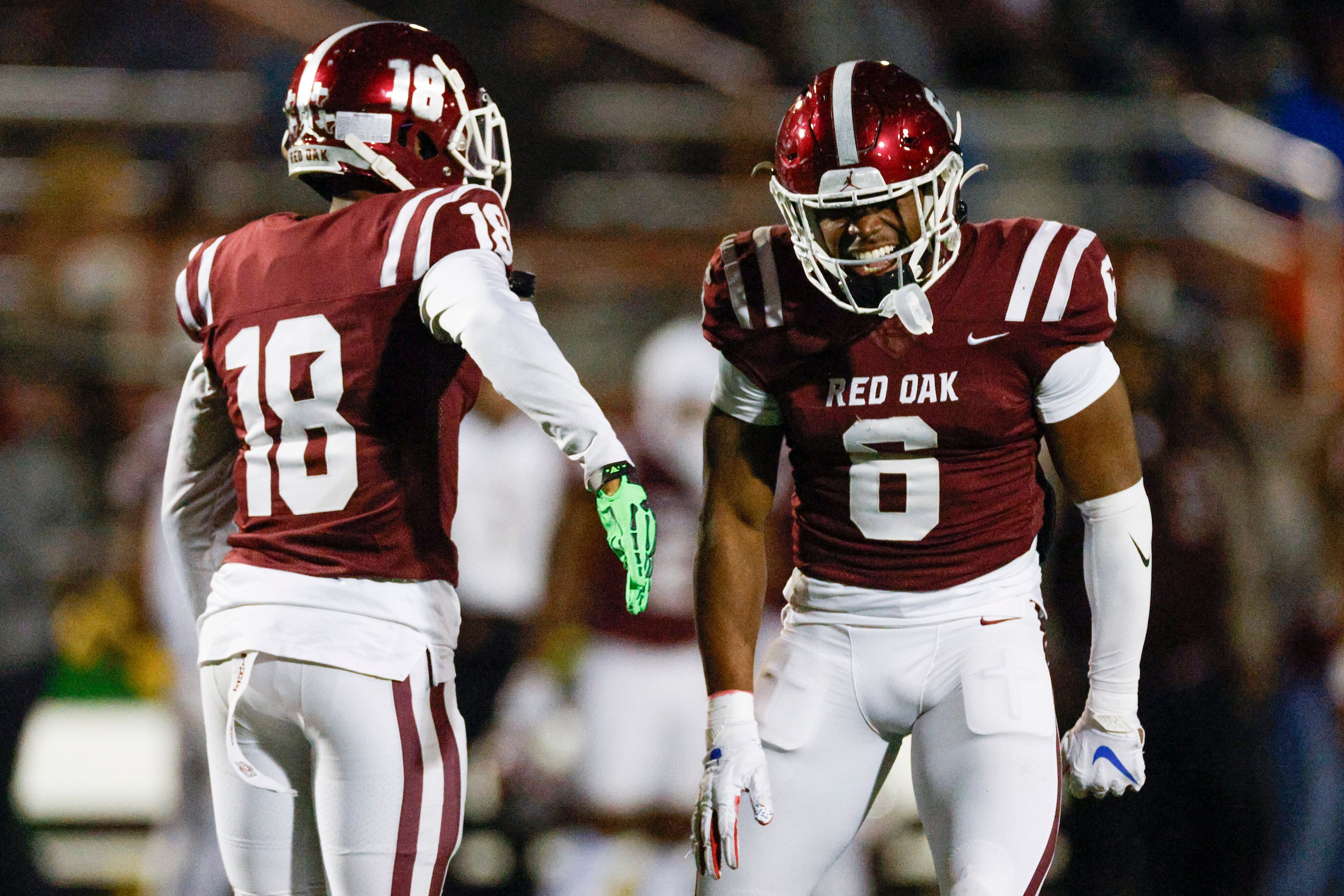 Red Oak defensive back Dhillion McGee (18) and linebacker Zach Smith (6) celebrate after a...