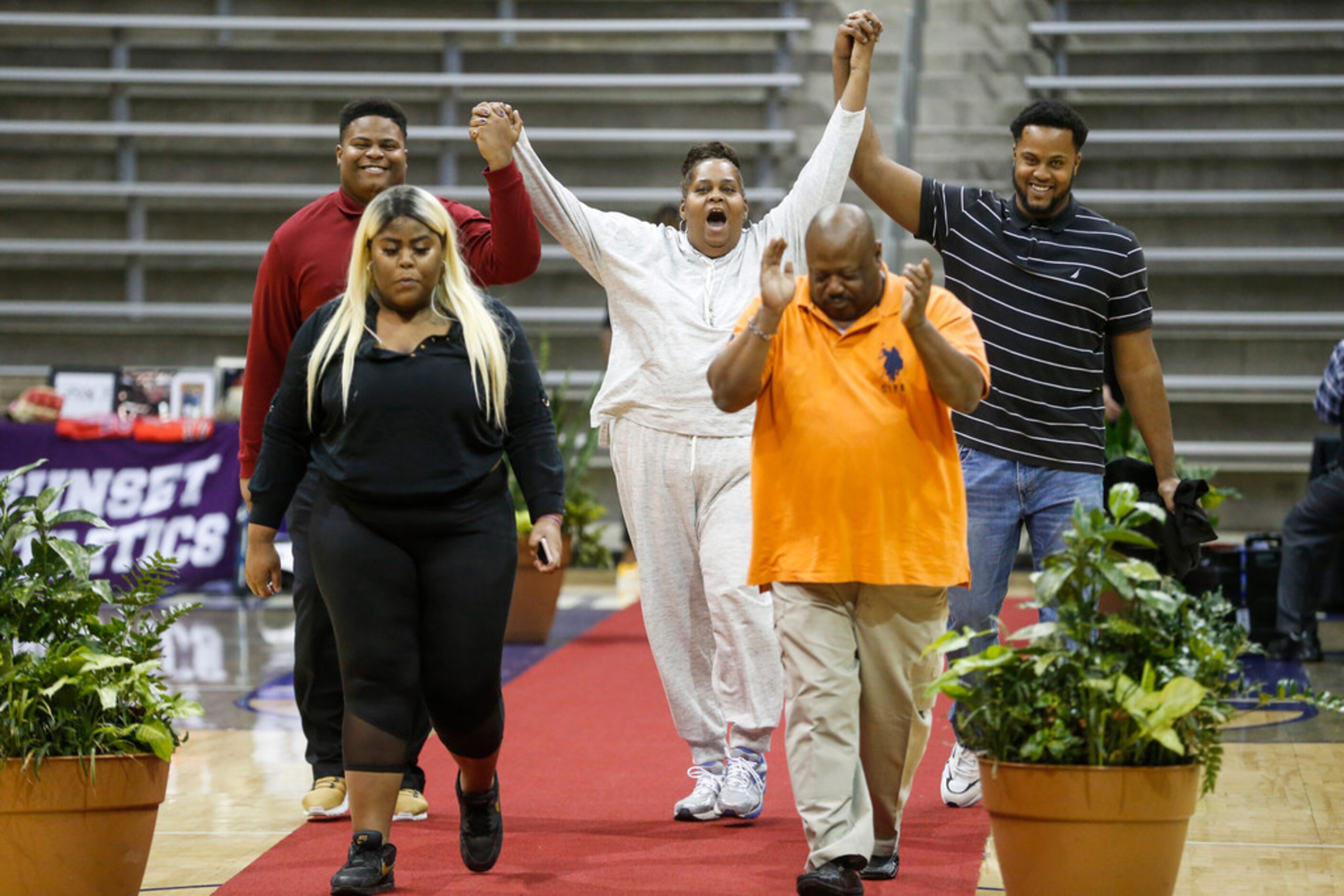 Skyline High School's Kamon Bradford, far left, who signed to play football at Navarro...