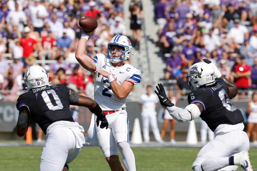 Southern Methodist Mustangs quarterback Preston Stone (2) passes under pressure from TCU...