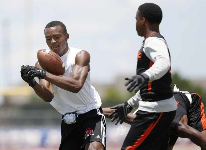 St. Thomas receiver Jhamon Ausbon misses a pass in the first half during the TAPPS 7-on-7...