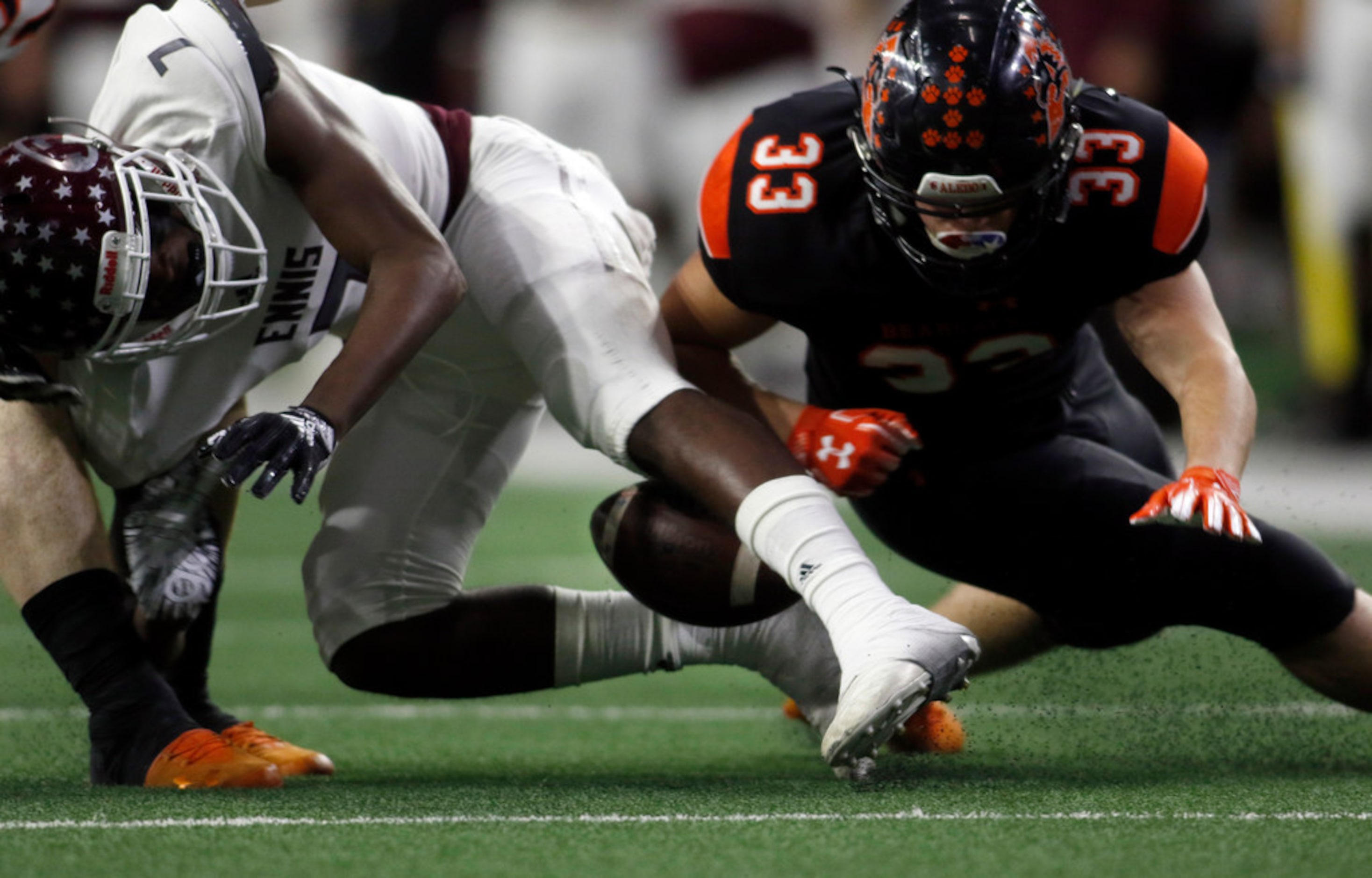 Ennis special teams player Laylon Spencer (7) fumbles a kickoff return attempt as Aledo...