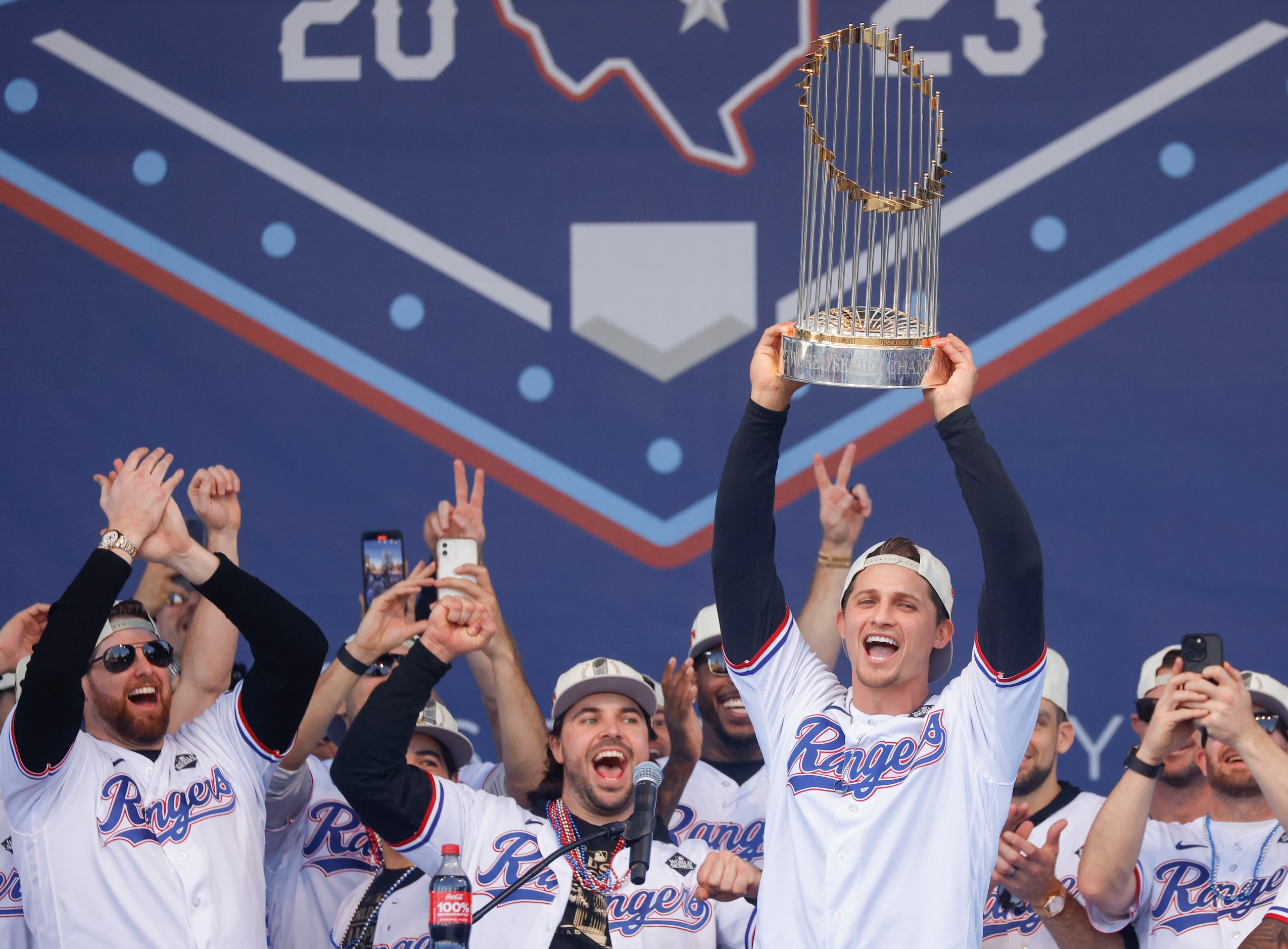 Texas Rangers’ Corey Seager hoists the Commissioner's Trophy during Texas Rangers World...