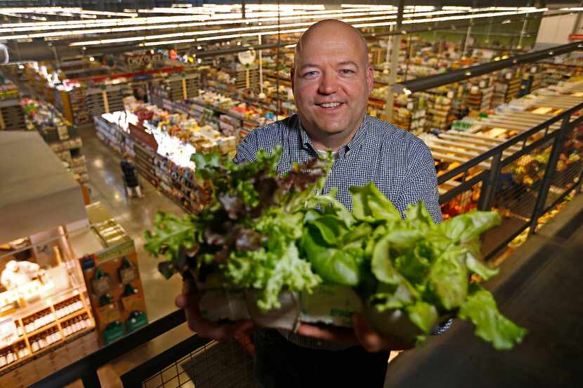 Marty Mika, business development manager of Central Market, poses for a photograph with...